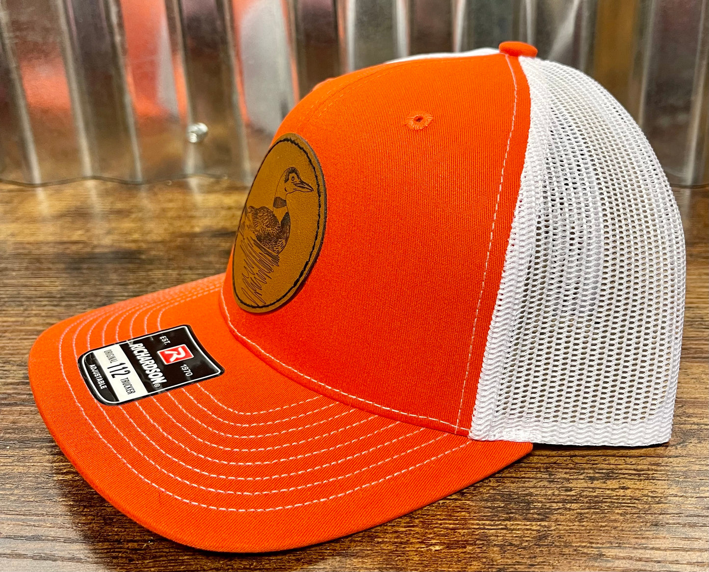 Custom leather patch trucker hat orange/white